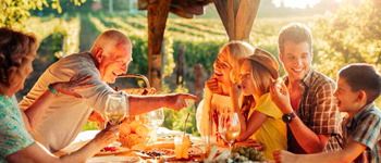 Family gathering together outdoors