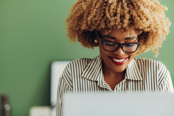 Woman on laptop setting stop orders