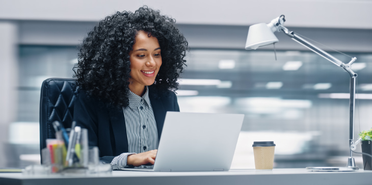 Young woman researching laptop