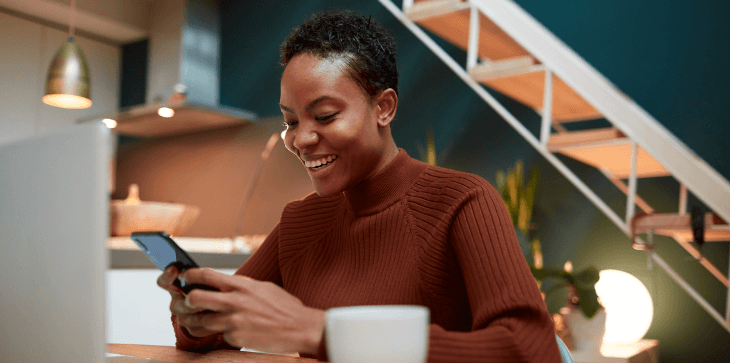 A woman trading options on the Edge Mobile app