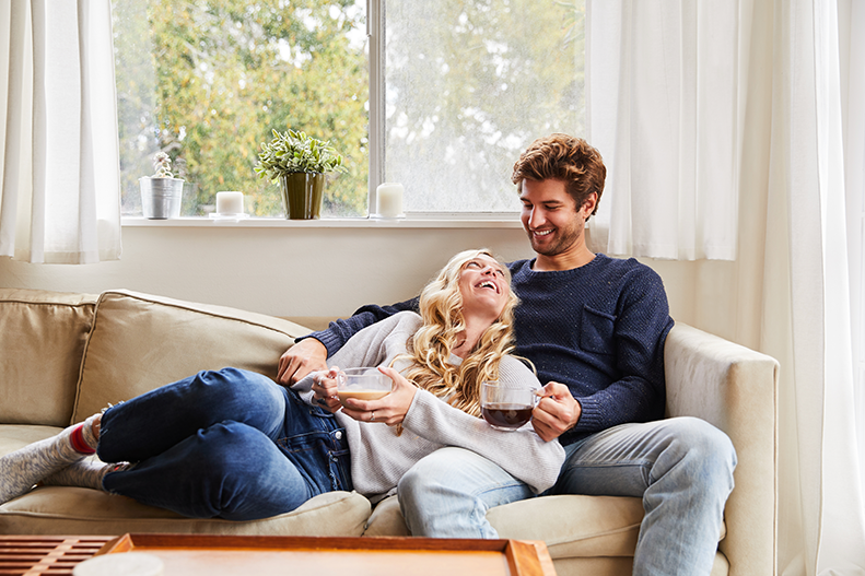 couple sitting on a sofa