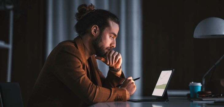 Man at computer checking his buying power